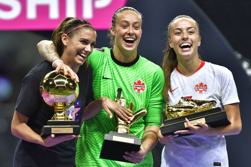 MONTERREY, MEXICO - JULY 18: Alex Morgan of USA best player, Kailen Sheridan goalkeeper of Canada best goalkeeper and Julia Grosso of Canada top scorer of the tournament pose with their trophies after the championship match between United States and Canada as part of the 2022 Concacaf W Championship at BBVA Stadium on July 18, 2022 in Monterrey, Mexico. (Photo by Jaime Lopez/Jam Media/Getty Images)