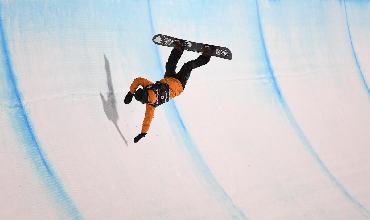 MAMMOTH, CALIFORNIA JANUARY 1, 2018-Danny Davis falls after hitting his head while landing on the halfpipe in the Men's Halfpipe Finals competetion in Mammoth Mountain Saturday. (Wally Skalij/Los Angeles Times)