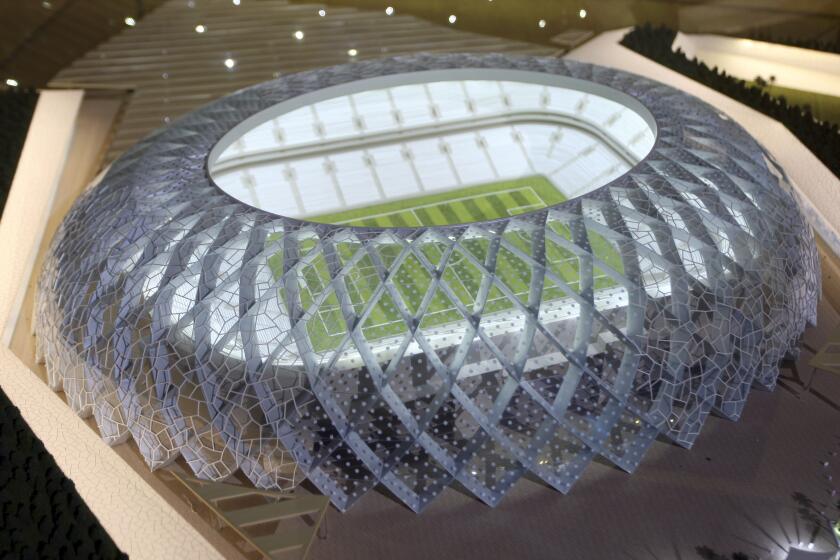 FILE-- In this Sept. 16, 2010 file photo, Qatar presents a model of its Al-Wakrah stadium, as the host of the 2022 World Cup, in Doha, Qatar. Qatar has already attracted plenty of attention for the futuristic and colorful designs of its dozen proposed World Cup stadiums, including one shaped like a traditional Arabic fishing boat and another like a sea urchin. But the architects of the tiny Gulf nation's stadiums have now unveiled detailed plans that will allow organizers to remove as many as 170,000 seats from nine of the venues and send them to 22 locations in the developing world. (AP Photo/Osama Faisal, File)