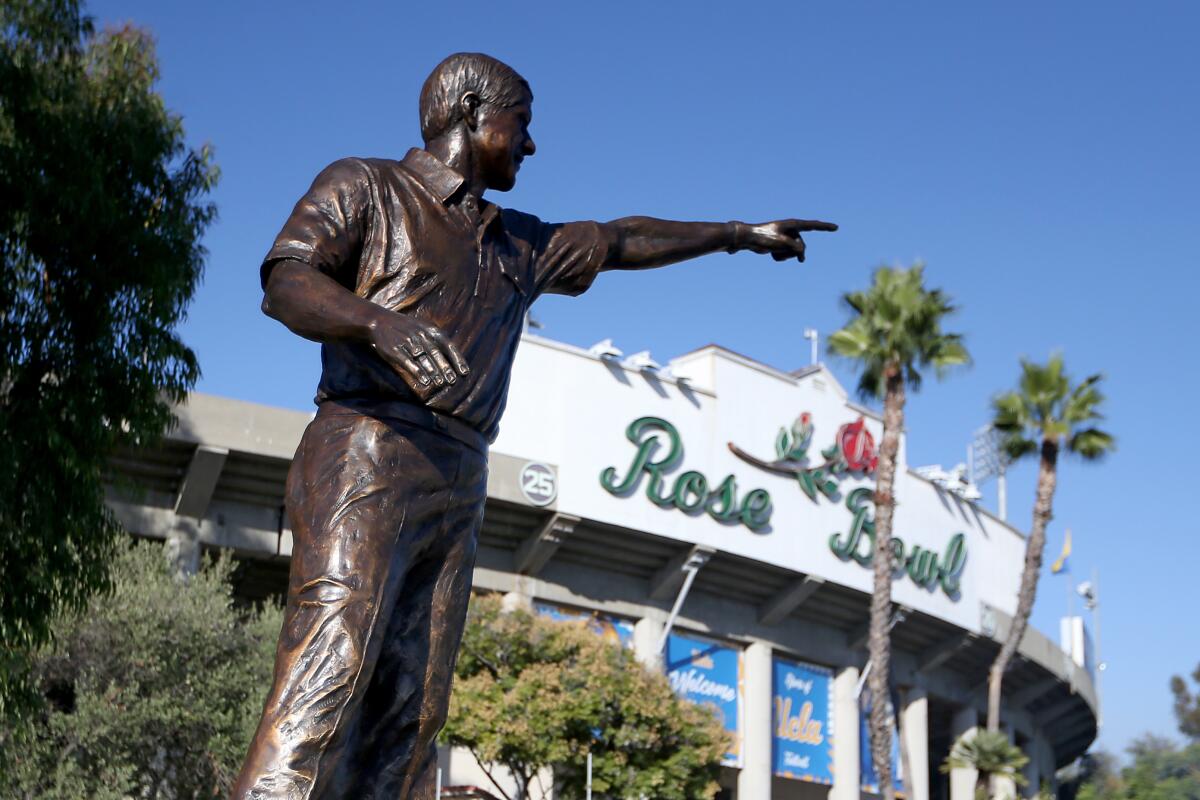 A statue of former UCLA football coach Terry Donahue stands outside the Rose Bowl in Pasadena.