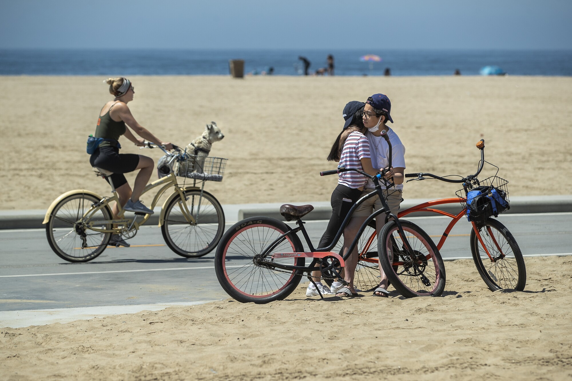 People on bikes at the beach