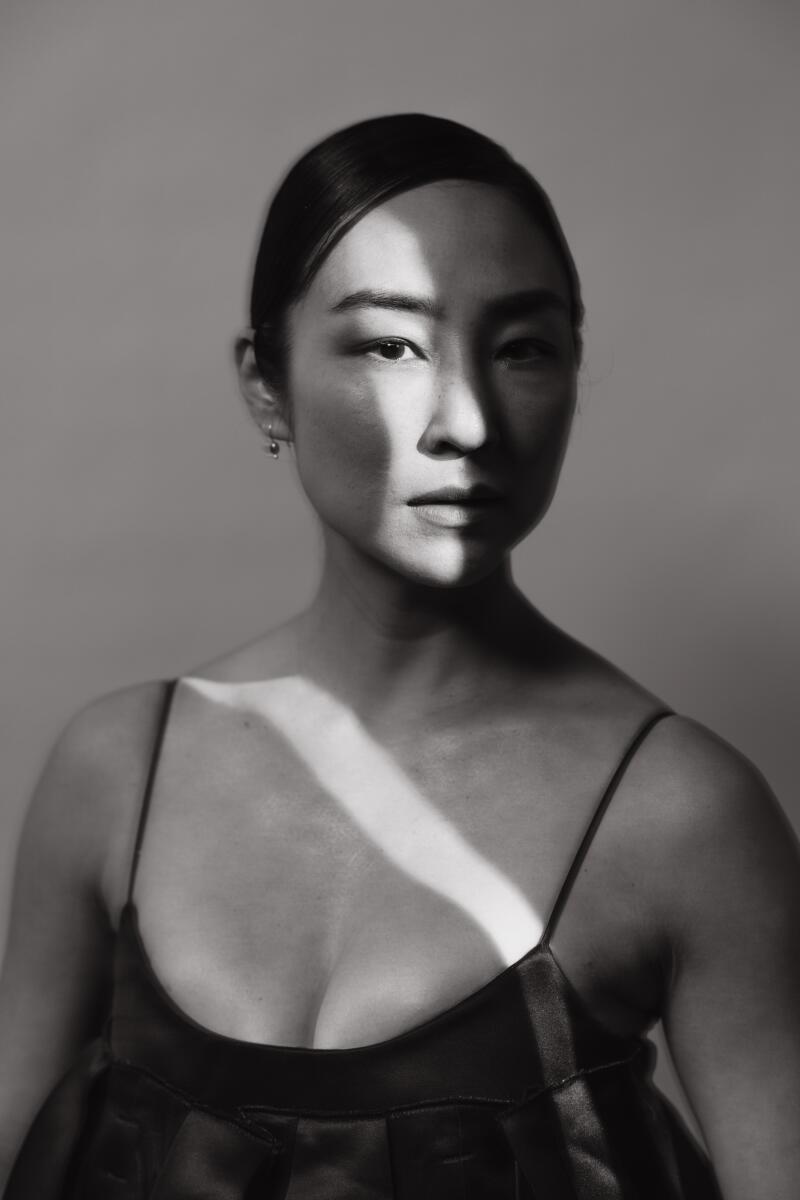 Greta Lee, from the film "Past Lives," and recipient of the Crystal Award for Advocacy, is photographed in the Los Angeles Times Portrait studio at the 2023 WIF (Women in Film) Honors, at the Ray Dolby Ballroom at Ovation Hollywood in Hollywood on Nov. 30. This year's WIF Honors celebrated WIF's 50th anniversary of fighting for gender equity in Hollywood and will recognize the women working on the front lines to change the entertainment industry for the better. (Jay L. Clendenin / Los Angeles Times)
