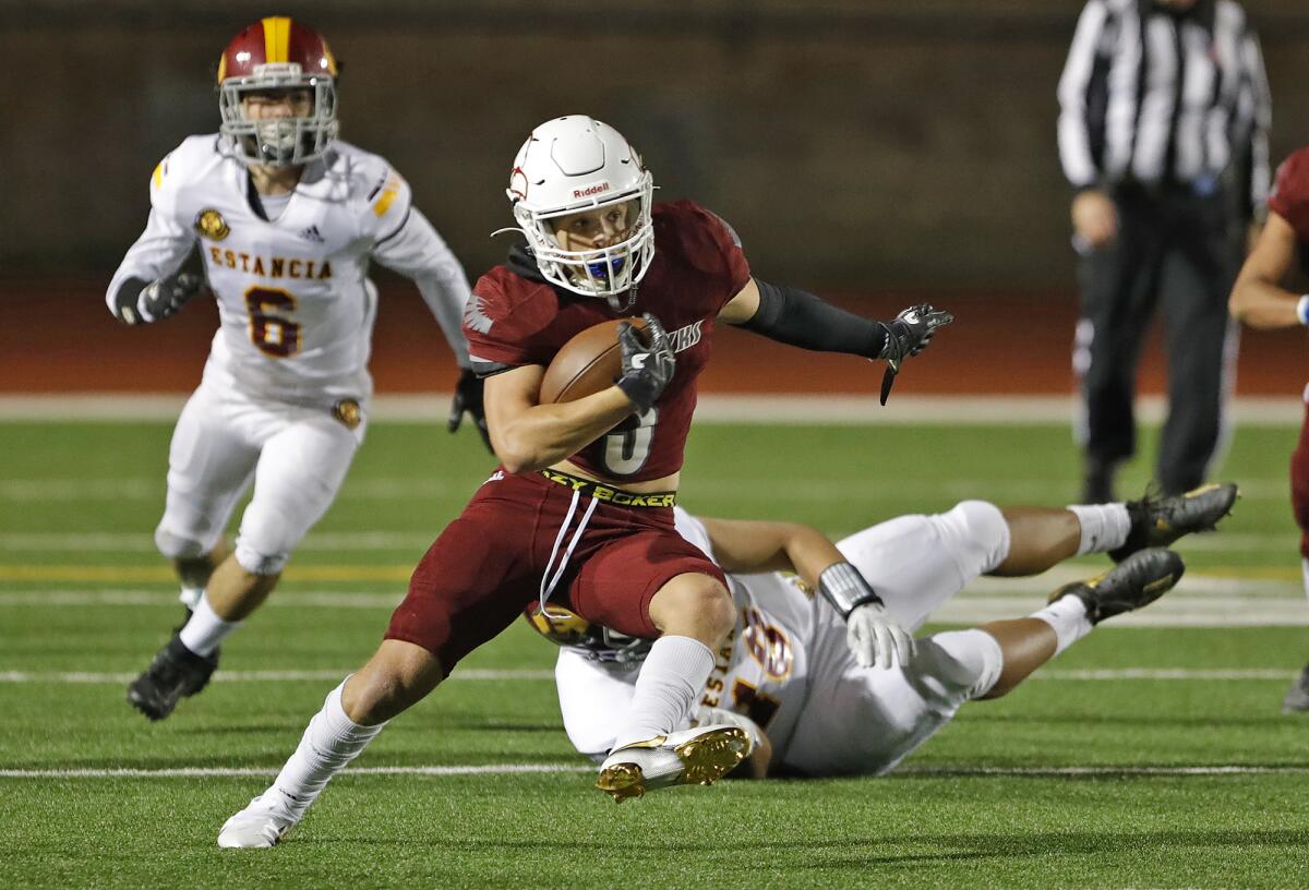 Ocean View running back Anthony Ramirez runs to the outside for a big gain against Estancia on March 12.