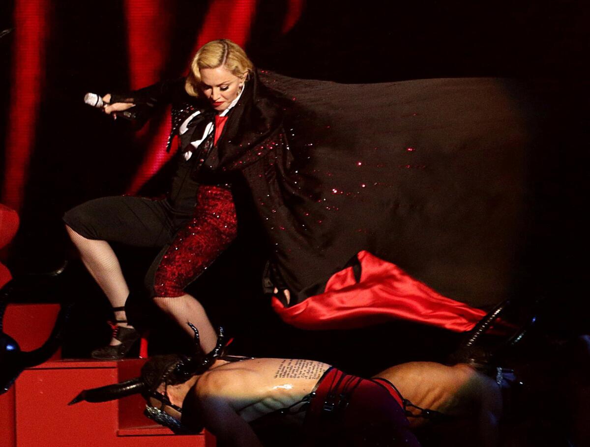Madonna took a hard tumble at the Brit Awards on Feb. 25.
