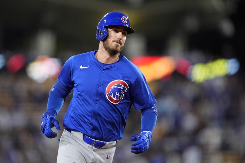 Chicago Cubs' Cody Bellinger rounds third after hitting a two-run home run during the first inning of a baseball game against the Los Angeles Dodgers, Monday, Sept. 9, 2024, in Los Angeles. (AP Photo/Mark J. Terrill)