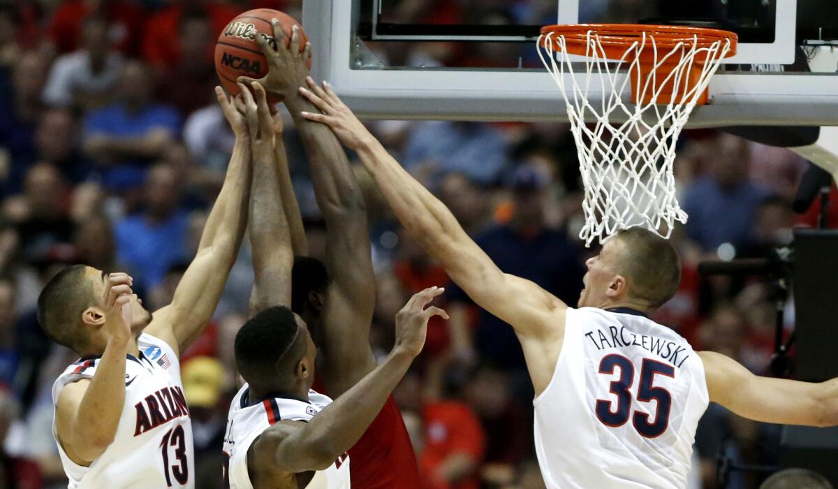 Center Kaleb Tarczewski (35) and his Arizona teammates went down to the wire in a loss to Wisconsin in the West Regional final last year at the Honda Center in Anaheim.