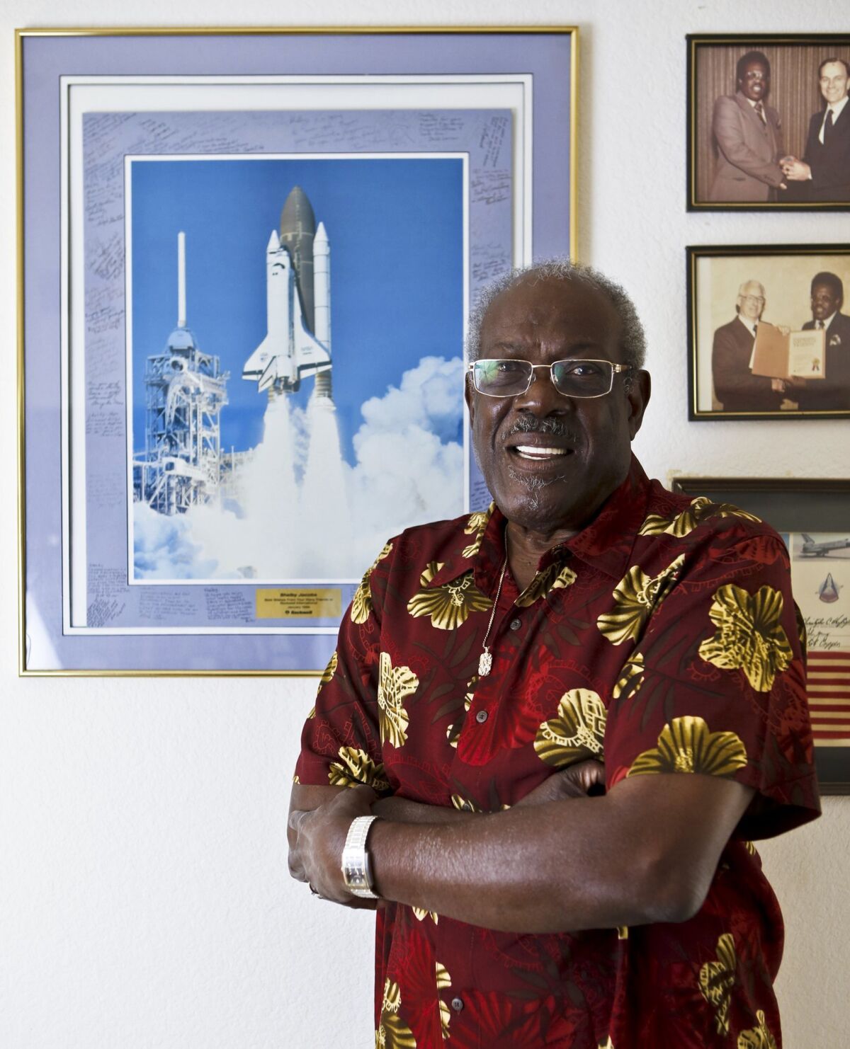 Shelby Jacobs, who turns 80 on April 27, pictured with some of his space program mementos at his Oceanside home.