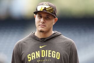 San Diego Padres' Manny Machado looks on in batting practice prior to a baseball game against the Boston Red Sox on Saturday, May 20, 2023, in San Diego. (AP Photo/Brandon Sloter)