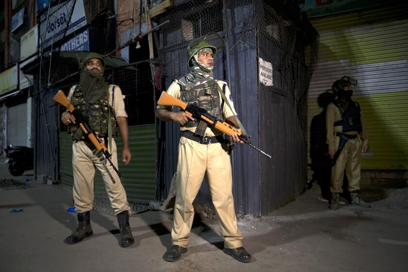 Indian soldiers stand guard in Srinagar, India, Sunday, Aug. 4, 2019. Tensions have soared along the volatile, highly militarized frontier between India and Pakistan in the disputed Himalayan region of Kashmir, as India has deployed more troops and ordered thousands of visitors out of the region. (AP Photo/ Dar Yasin)