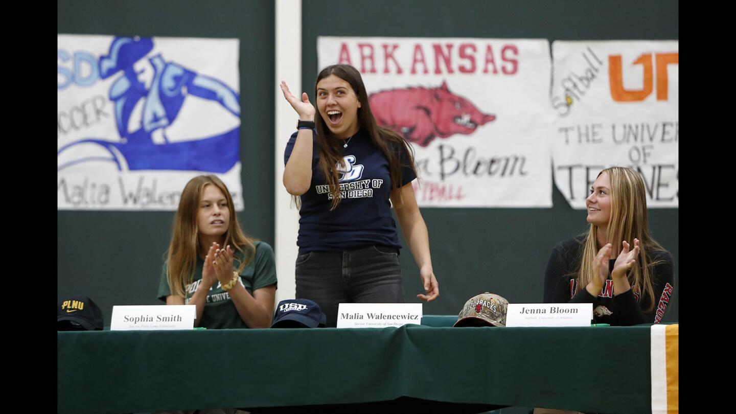 Maila Walencewicz stands as she is introduced during a signing day ceremony at Edison High on Thursday.