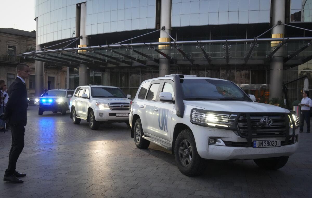 Vehicles containing U.N. experts leaving Kyiv, Ukraine