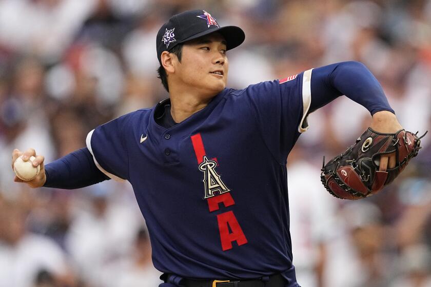 American League's starting pitcher Shohei Ohtani, of the Los Angeles Angeles, throws during the first inning of the MLB All-Star baseball game, Tuesday, July 13, 2021, in Denver. (AP Photo/Jack Dempsey)