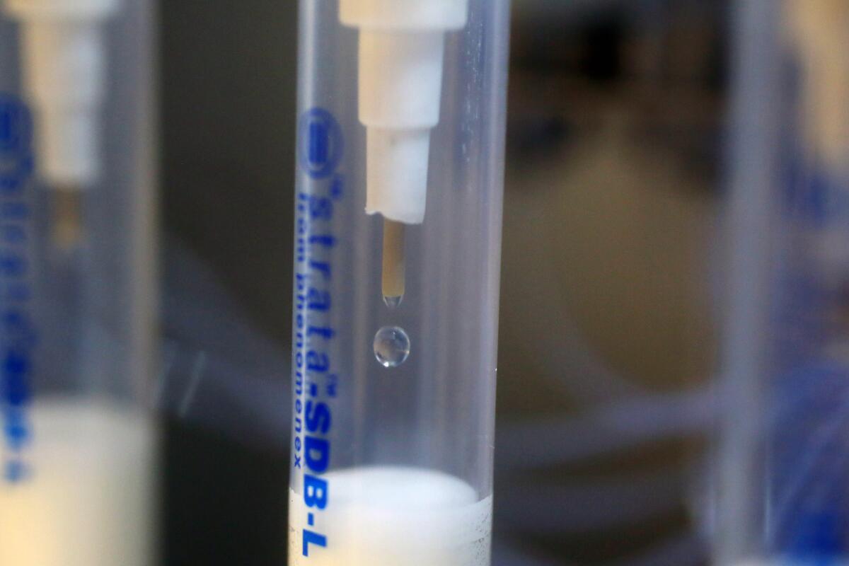 A clear tube with a syringe-like dropper inside 