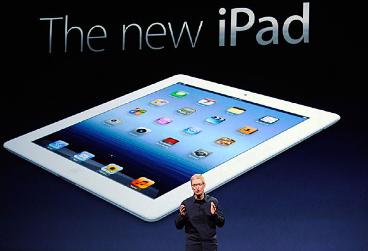 Apple Chief Executive Tim Cook introduces the new iPad -- featuring a sharper screen and a faster processor -- during an event in San Francisco. Apple says the new iPad will hit stores March 16.