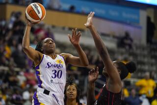 Los Angeles Sparks forward Nneka Ogwumike (30) shoots over Indiana Fever forward Teaira McCowan (15) in the first half of a WNBA basketball game in Indianapolis, Tuesday, Aug. 31, 2021. (AP Photo/Michael Conroy)