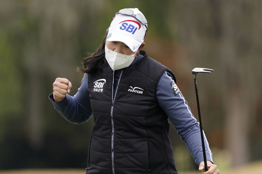 A Lim Kim, of South Korea, reacts after making a birdie on the 18th hole.