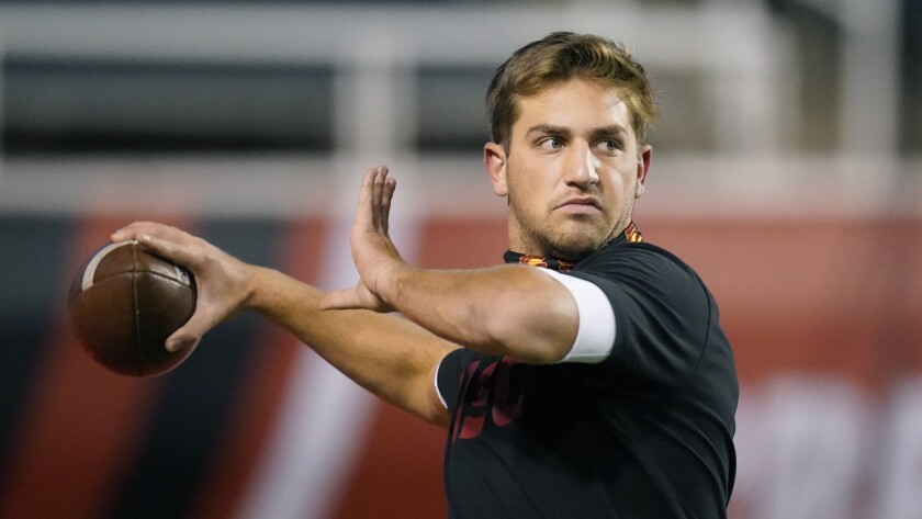 USC quarterback Kedon Slovis throws the football while warming up before a game against Utah 