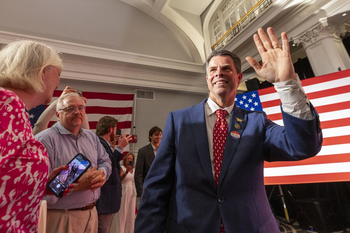 Virginia state Sen. John McGuire waves to supporters