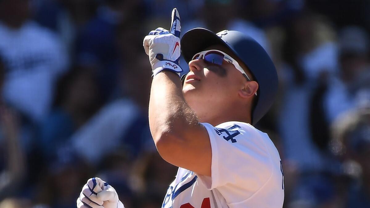 Dodgers left fielder Joc Pederson points to the sky after hitting his second home run of the game during the sixth inning of Thursday's win over the Arizona Diamondbacks.