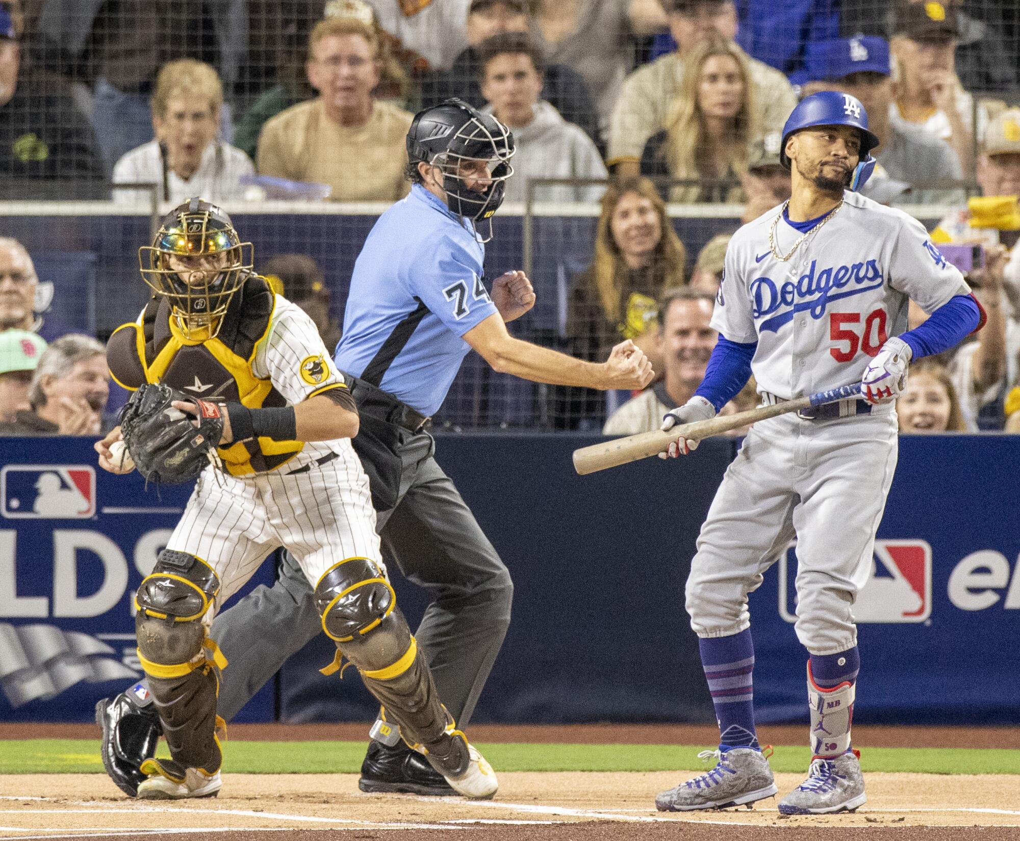 Dodgers right fielder Mookie Betts strikes out during the first inning in Game 4 of the NLDS against the Padres.