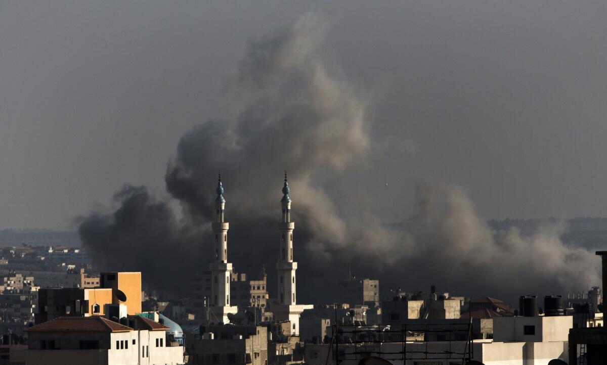 Smoke billows following an Israeli military strike on Gaza City.