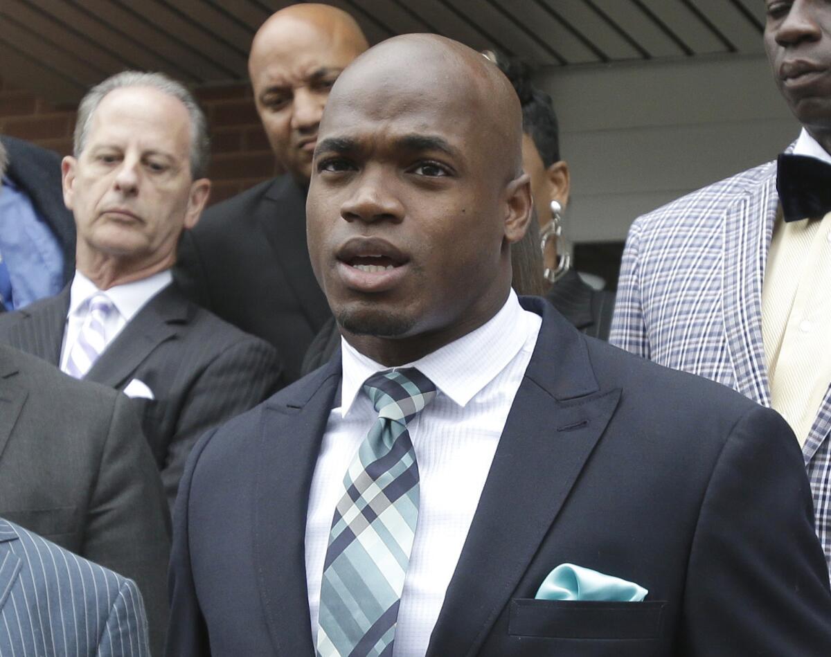 Minnesota Vikings running back Adrian Peterson speaks to the media Nov. 4 after pleading no contest to an assault charge in Conroe, Texas.