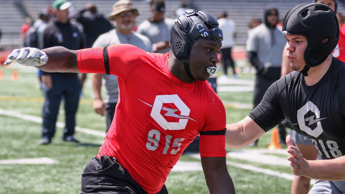 Orange Vista defensive end Dion Wilson Jr. tries to get around the edge against USC offensive lineman commit Caadyn Stephen at the Opening Oakland Regional on May 11.