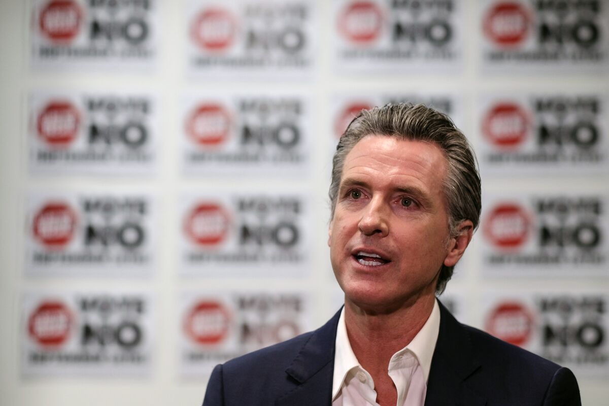 California Gov. Gavin Newsom is photographed during a TV interview before a rally against the California gubernatorial recall election on Sunday, Sept. 12, 2021, in Sun Valley, Calif. (AP Photo/Ringo H.W. Chiu)