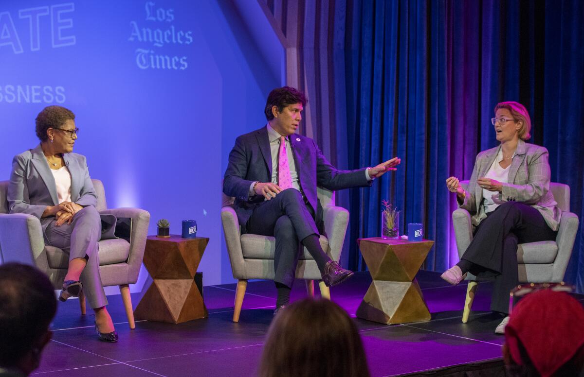 L.A. mayoral candidates from left, Karen Bass, Kevin de León and Gina Viola participate in a debate on homelessness.