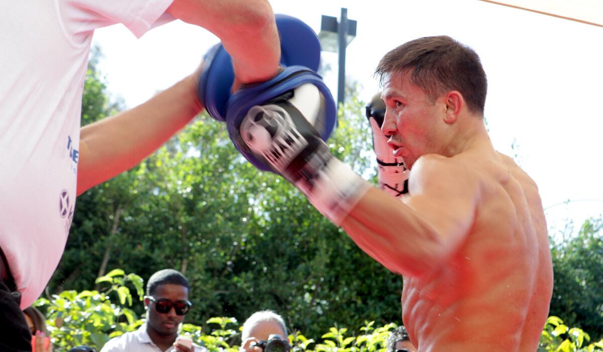 Gennady Golovkin hits the mitts with trainer Abel Sanchez during a workout for the media on Wednesday in Santa Monica.