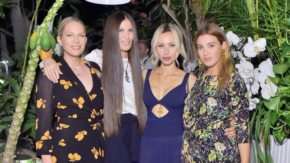 From left, Erin Foster, Elizabeth Saltzman, Camilla Fayed and Jamie Mizrahi attend the launch of Fayed's "Farmacy Kitchen Cookbook" at Schoos Design in West Hollywood.