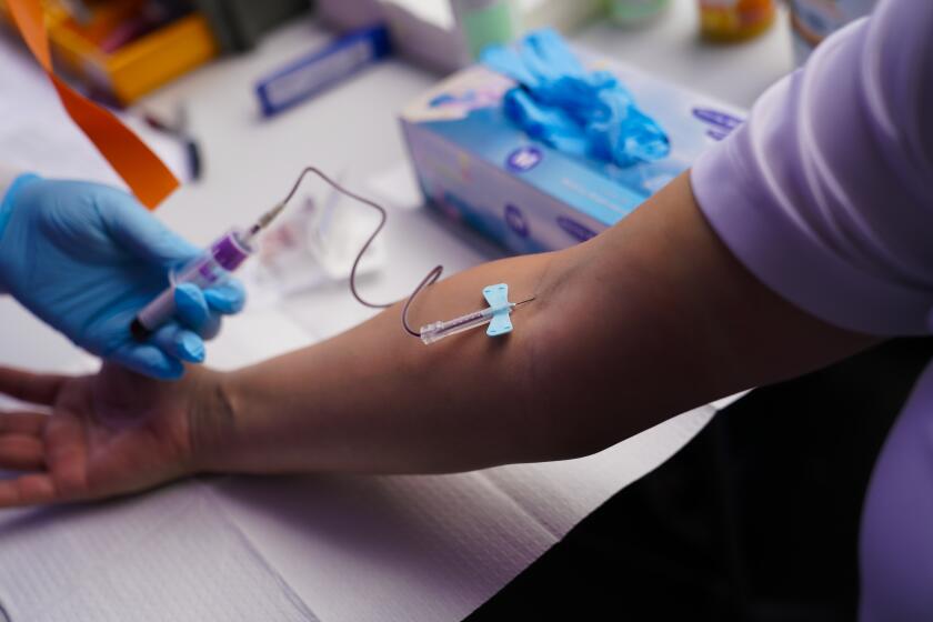 In Mira Mesa, an employee takes a blood test to determine if he carries coronavirus antibodies.