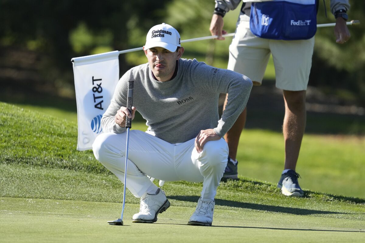 Patrick Cantlay lines up a putt on the 10th green of Spyglass Hill during the second round Feb. 4, 2022. 