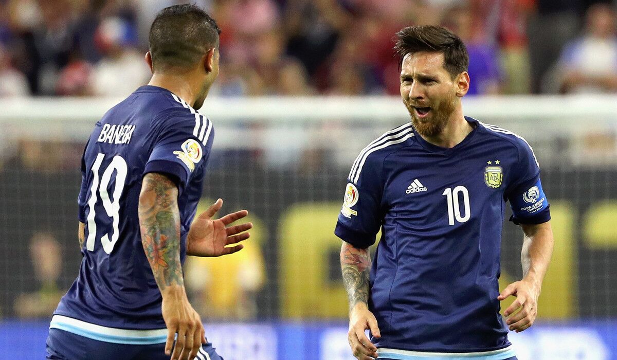 Argentina's Lionel Messi, right, celebrates with Ever Banega after scoring on a free kick in the first half against the United States during a 2016 Copa America Centenario semifinal on Tuesday at Houston.
