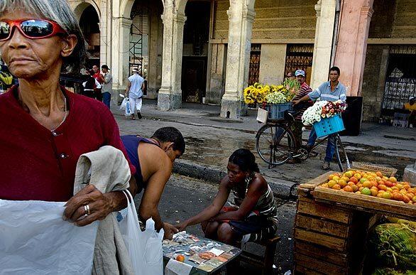 Cuban vendors selling spices, fruit, flowers and other items set up their goods every Sunday at the farmers market across the street from the National Capitol building in central Havana, formerly the seat of the Cuba congress.