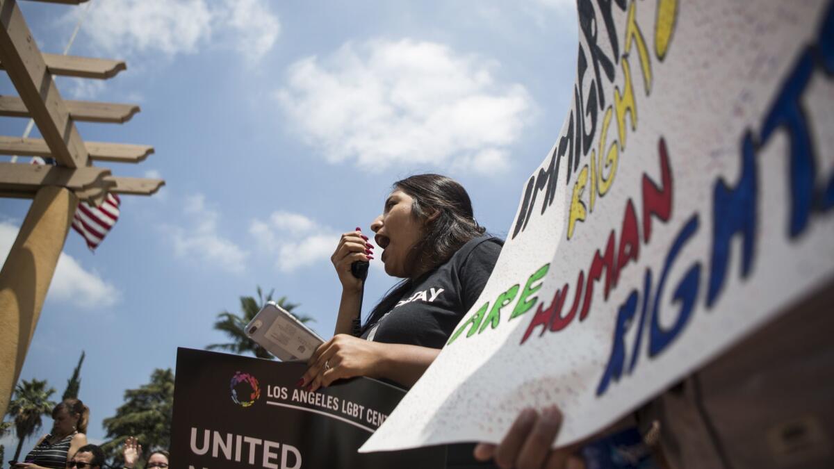 Supporters of the Deferred Action for Childhood Arrivals, or DACA, program rally in Pasadena outside the federal appeals courthouse, where judges heard arguments Tuesday in the Trump administration's bid to end the program.