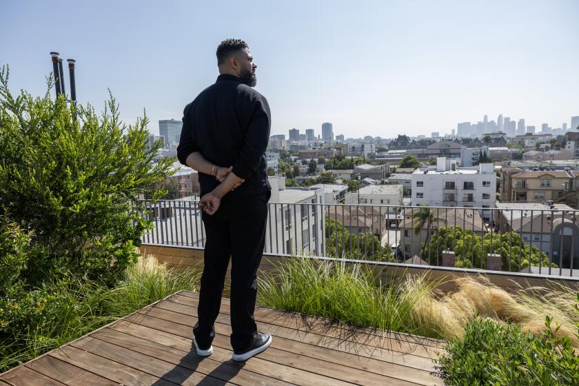 LOS ANGELES, CA - JULY 18: View from the rooftop garden. Prophet Walker built a co-living apartment with help from LA4LA - a government, philanthropic and private sector alliance - allowing the building to be completed and converted into homeless housing. Photographed on Gramercy Place in Los Angeles, CA on Thursday, July 18, 2024. (Myung J. Chun / Los Angeles Times)