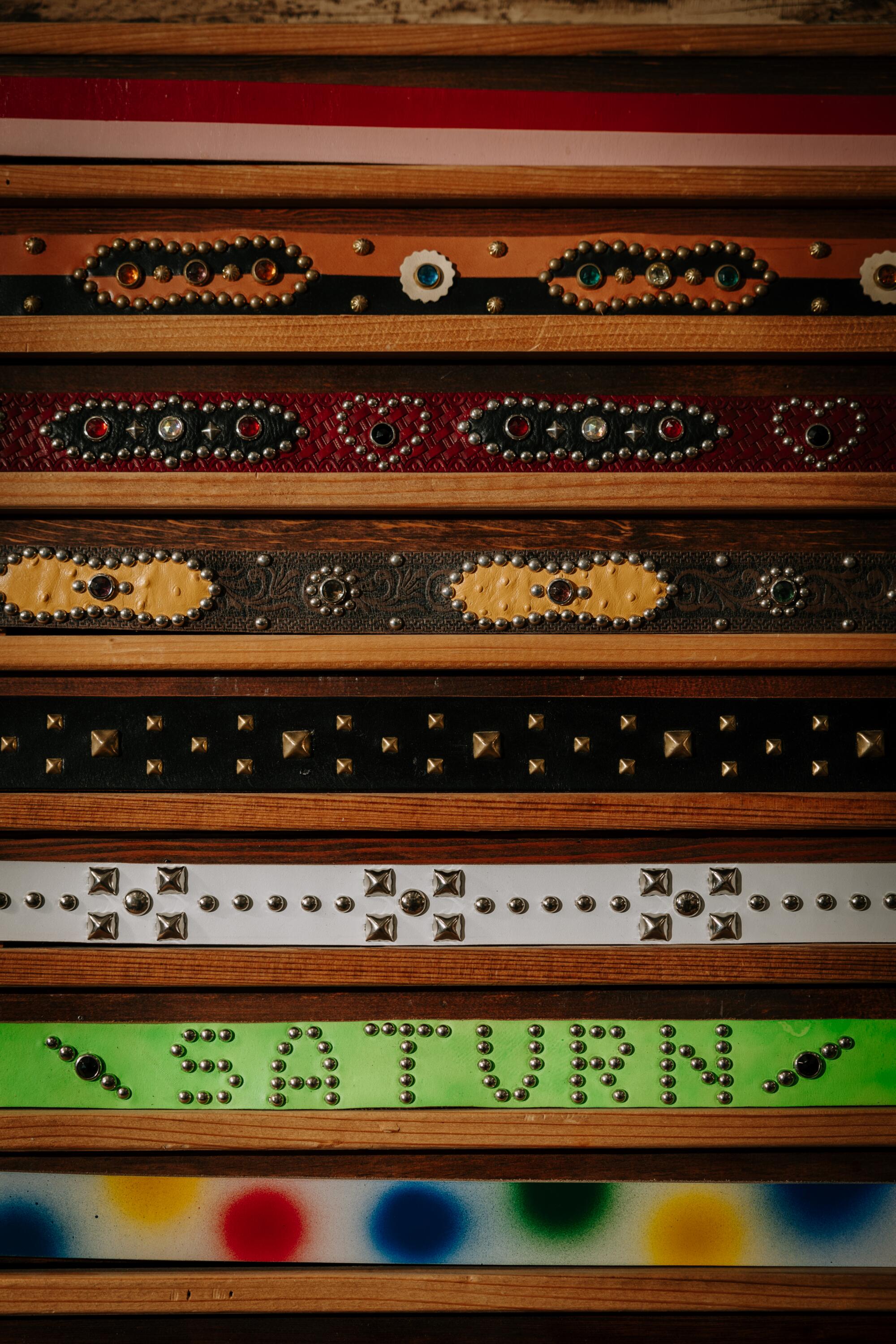 A wall of belts at Dunrite Leatherworks studio and showroom in Little Tokyo.