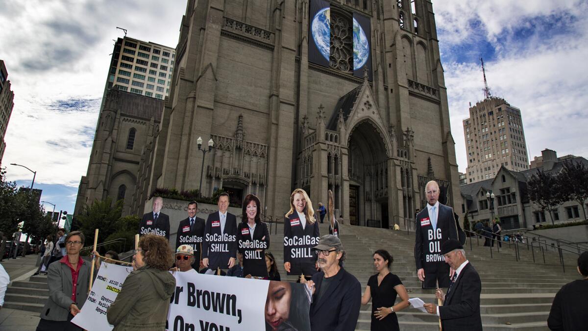 Demonstrators rally on the steps of the Grace Cathedral on Wednesday to call on Gov. Brown to shut down the Aliso Canyon gas field.