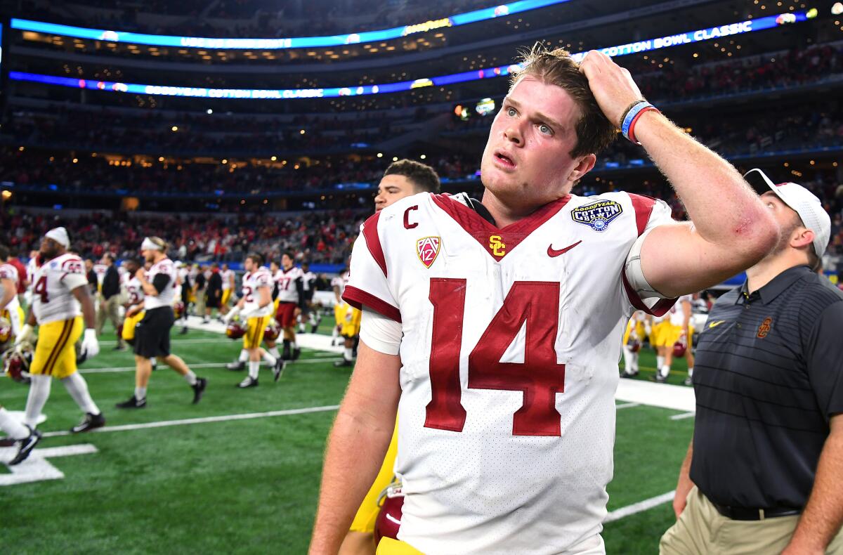 USC quarterback Sam Darnold walks off the field losing after the Trojans' loss to Ohio State.