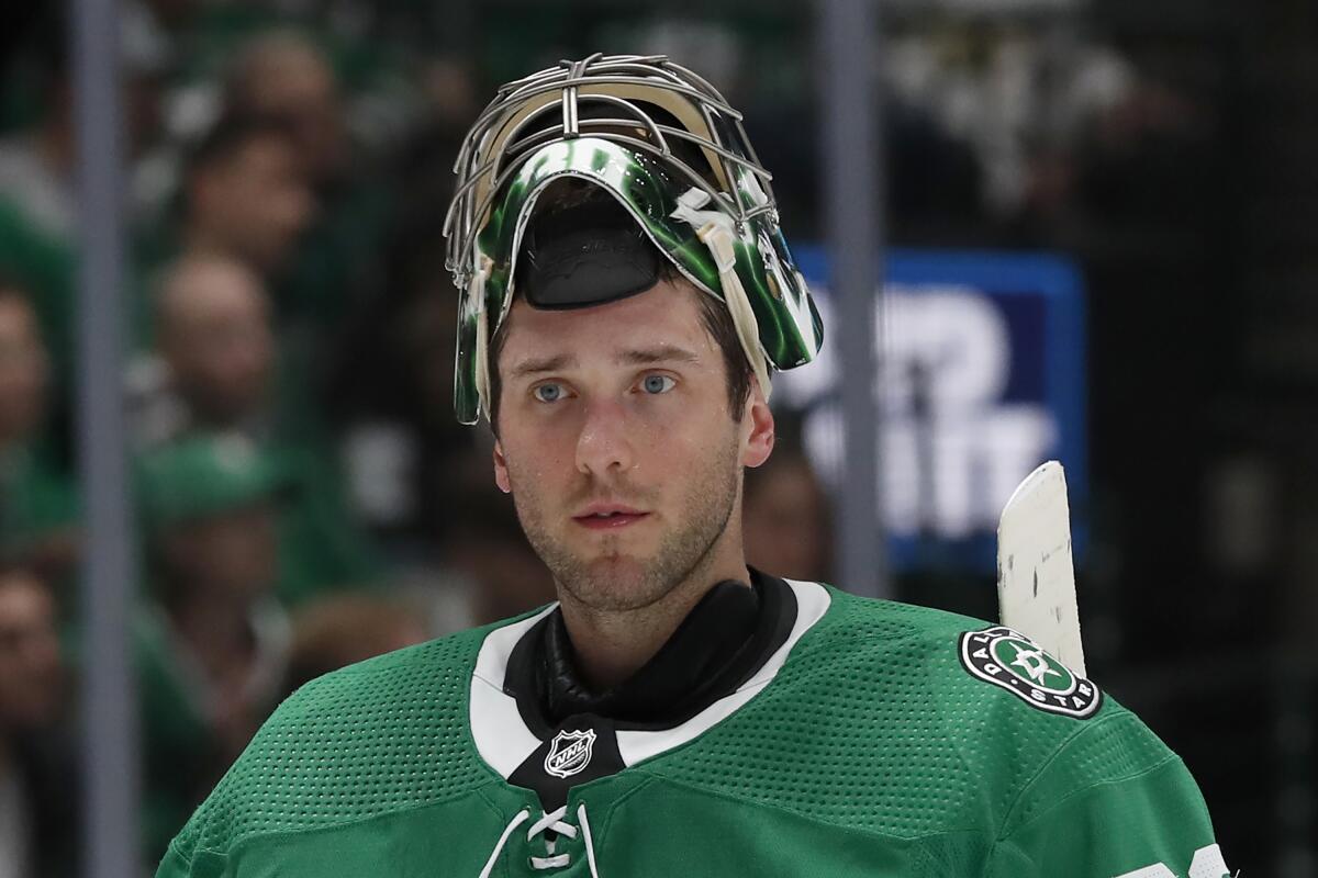 FILE - Dallas Stars goaltender Ben Bishop is shown during an NHL hockey game against the Vancouver Canucks in Dallas, in this Tuesday, Nov. 19, 2019, file photo. Stars goaltender Ben Bishop has waived his no-movement clause to be exposed in the Seattle expansion draft next week after approaching his team with the idea. The move, which the team confirmed Thursday, July 15, 2021, allows Dallas to protect veteran goalie Anton Khudobin from the Kraken. (AP Photo/Tony Gutierrez, File)