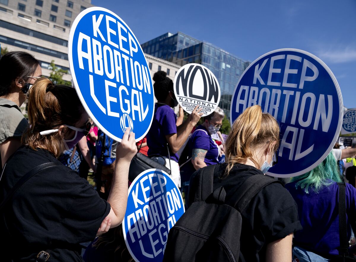 Demonstrators supporting abortion rights march.