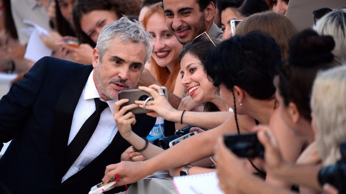 Alfonso Cuarón at Venice Film Festival with his new film for Netflix, "Roma."