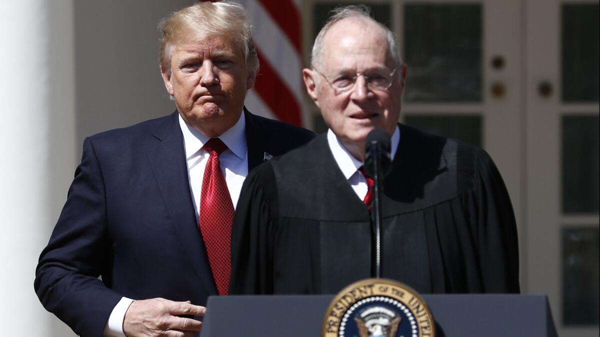 President Donald Trump, left, and Supreme Court Justice Anthony Kennedy participate in a public swearing-in ceremony for Justice Neil Gorsuch in the Rose Garden of the White House White House.