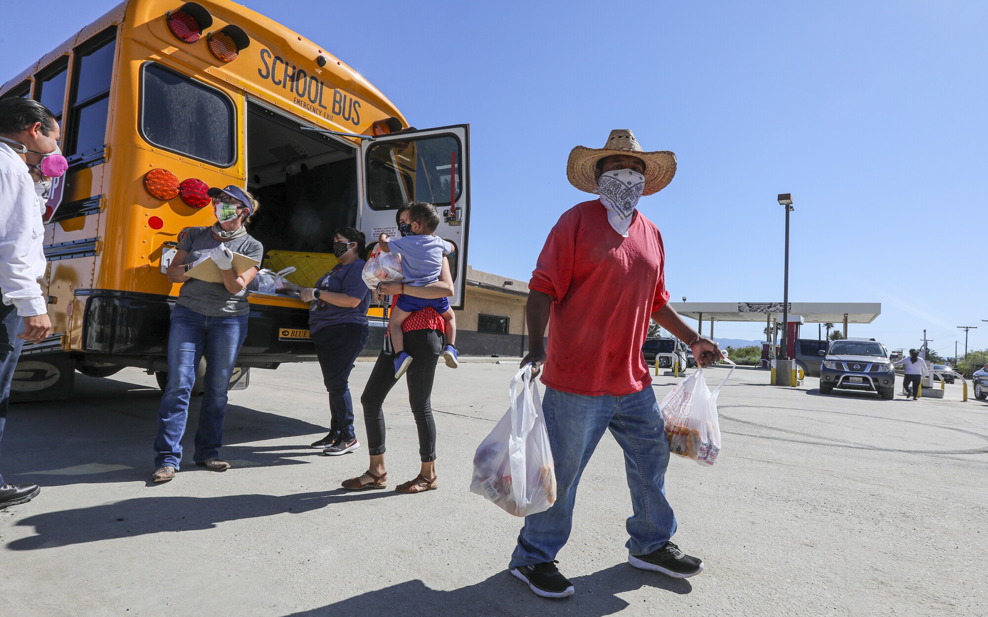 Coachella Valley Unified School District delivers meals in front of Oasis Mobile Home Park in Thermal