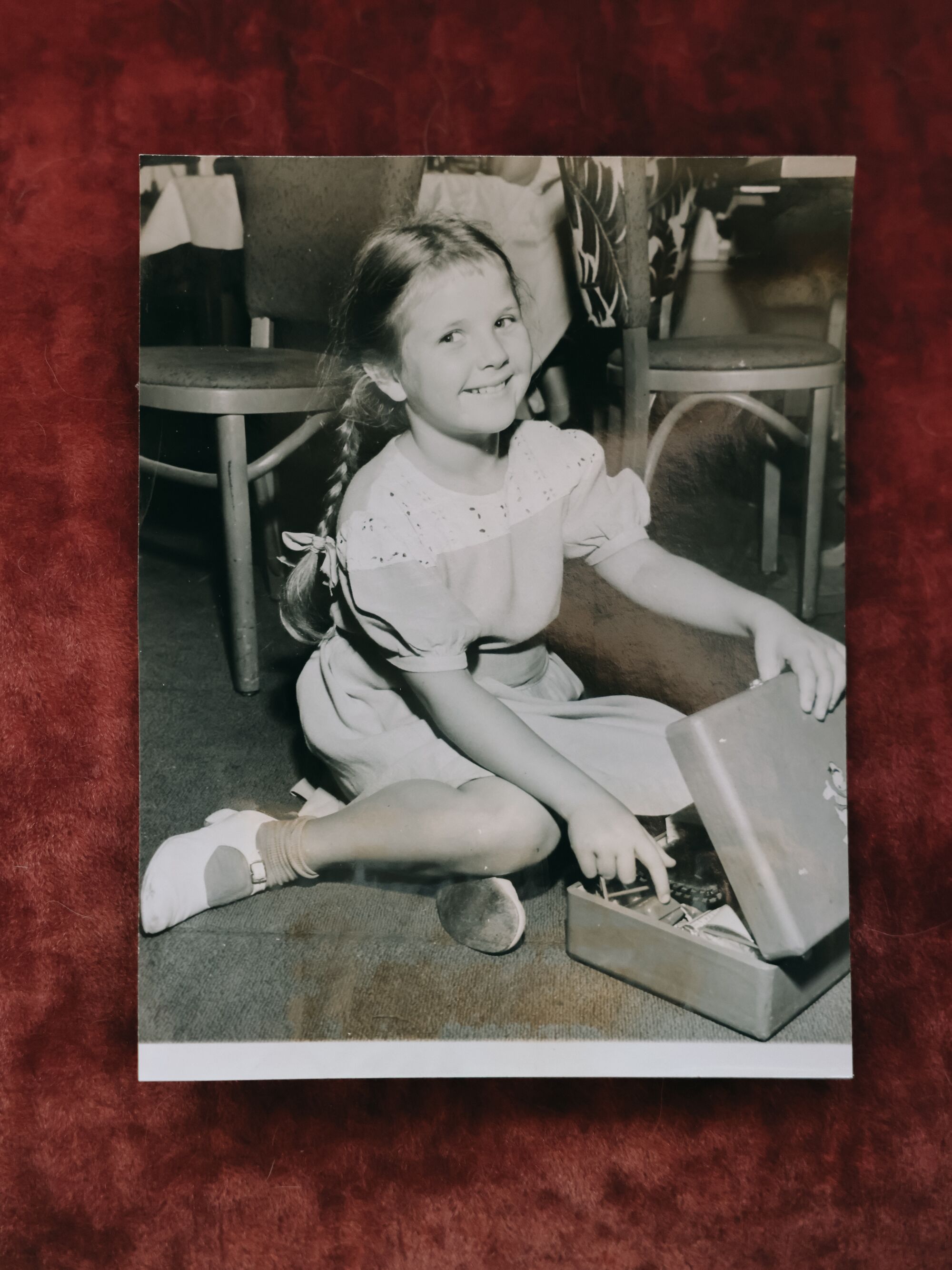 A girl with a small suitcase.