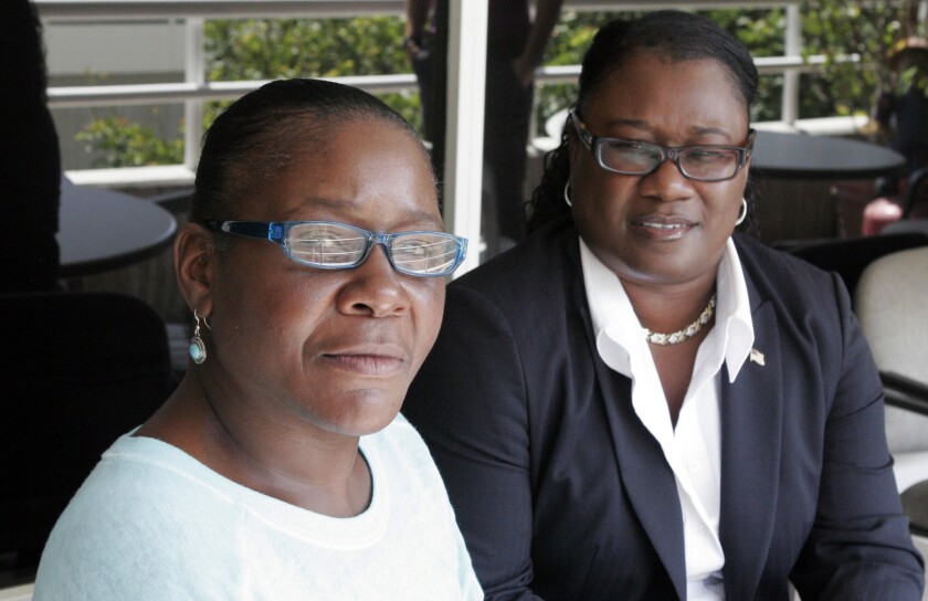 Marlene Pinnock, left, with her attorney, Caree Harper, during an August interview in Los Angeles.