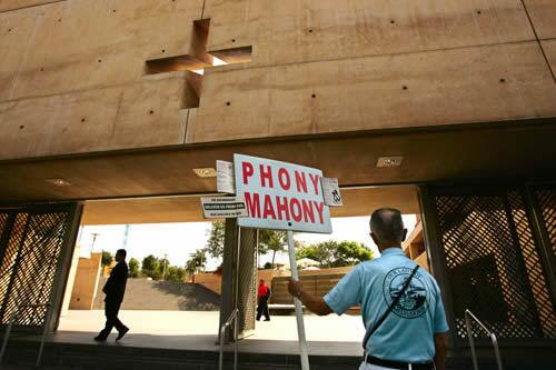 At the Cathedral of Our Lady of the Angels in downtown Los Angeles Sunday, Donald L. Kohles articulates his feelings about Cardinal Roger M. Mahony and the $660-million settlement with the Archdiocese of Los Angeles. Kohles said that his family has been affected by the scandal of priests accused of committing sexual abuse, but refused to elaborate.