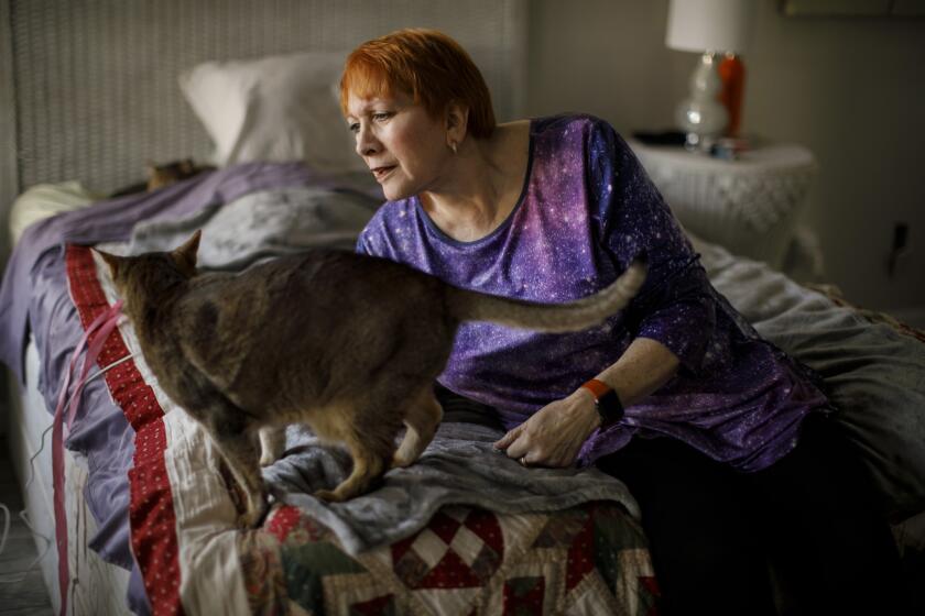 COTTONWOOD, CALIF. -- MONDAY, NOVEMBER 19, 2018: Lilli Heart escaped the Camp Fire with her cats Keeper and Kinde, as she seeks refuge at her friend's home in Cottonwood, Calif., on Nov. 19, 2018. (Marcus Yam / Los Angeles Times)
