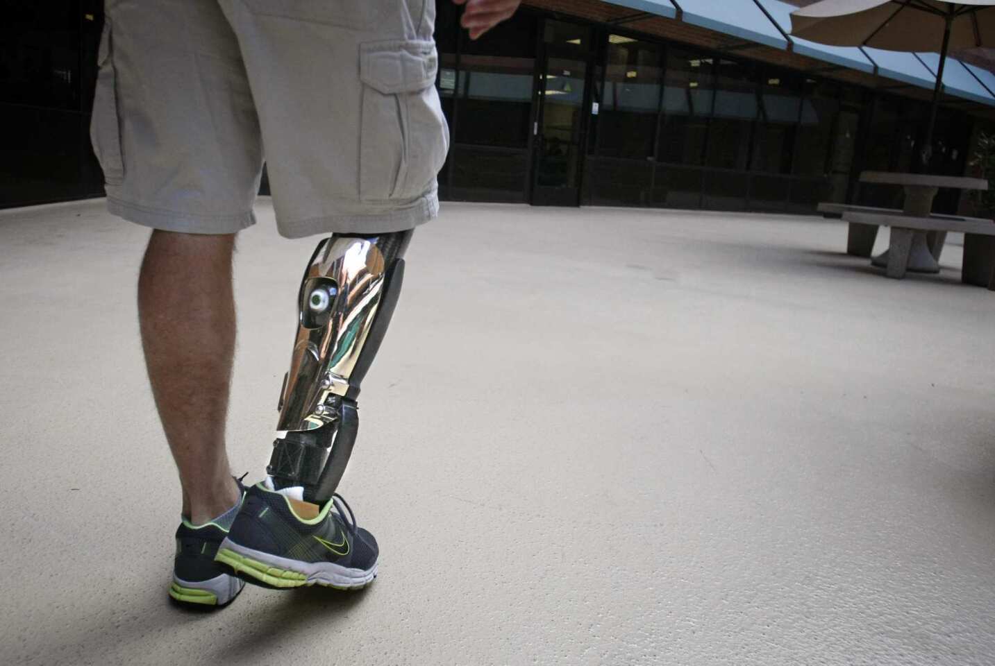 Army veteran Matt Sullivan walks to class in San Diego while wearing a customized prosthetic leg. He lost his leg in the Afghanistan war. Made by Bespoke Innovations of San Francisco, a polished metal fairing surrounds an existing prosthetic leg and is shaped like the calf of his good leg.